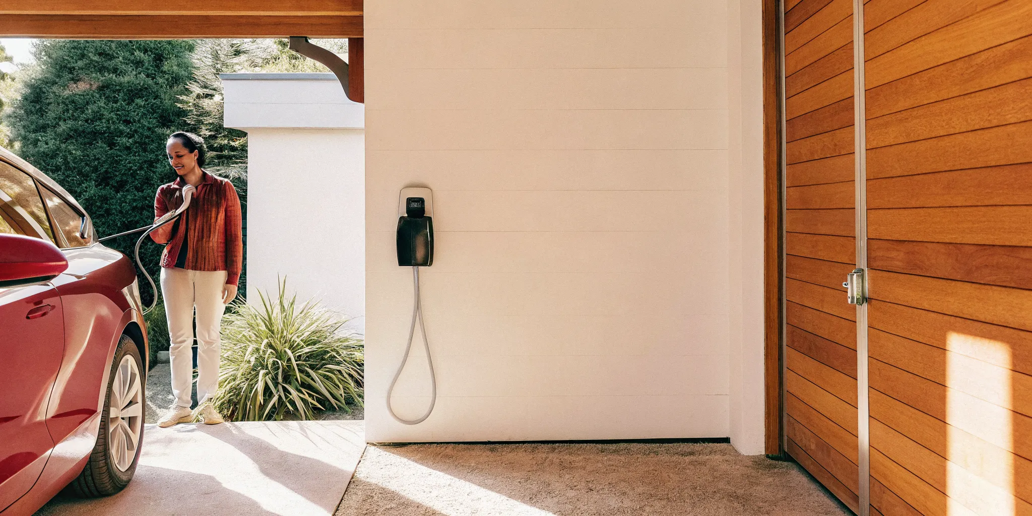 Level 2 EV charger installed in a modern suburban garage in Barrington Illinois.